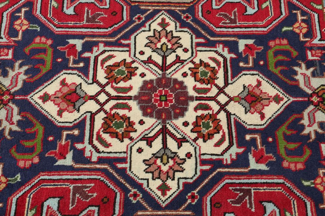 Hand-knotted Tabriz rug from the Middle East in a vibrant red colour