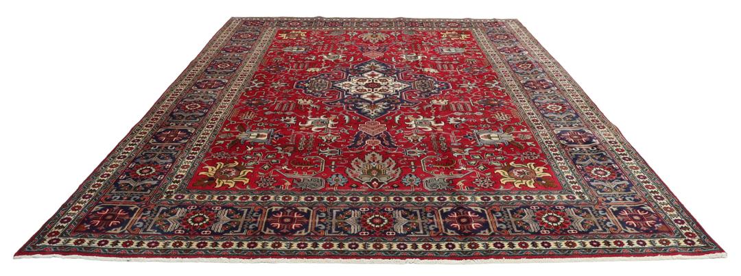Hand-knotted Tabriz rug from the Middle East in a vibrant red colour