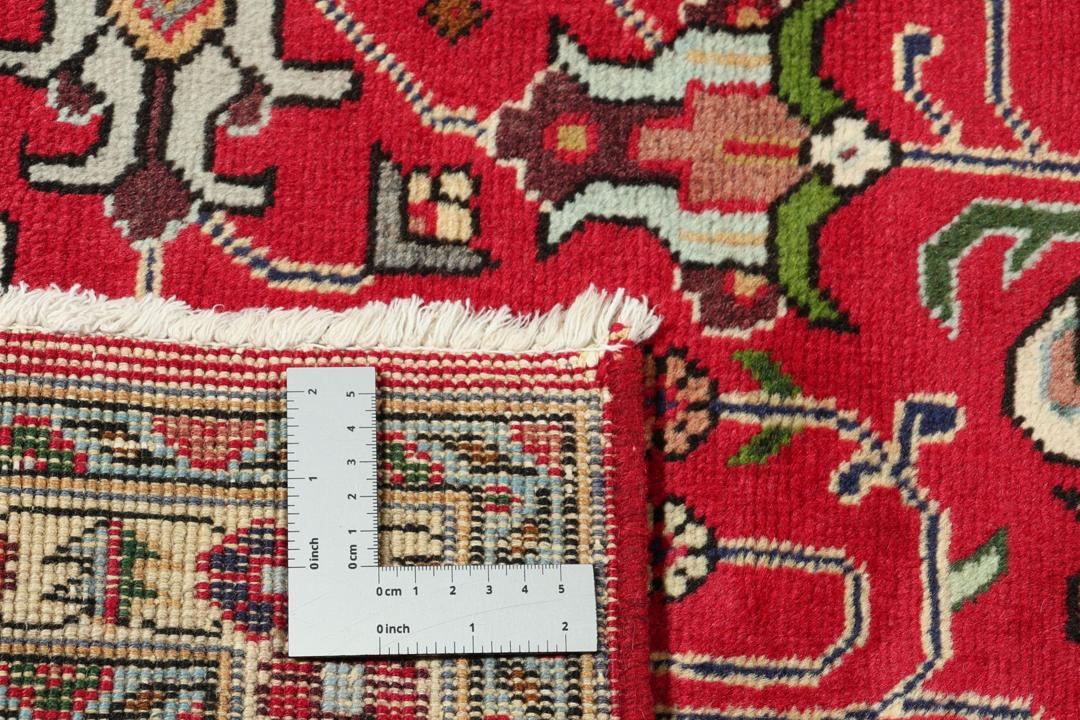 Hand-knotted Tabriz rug from the Middle East in a vibrant red colour