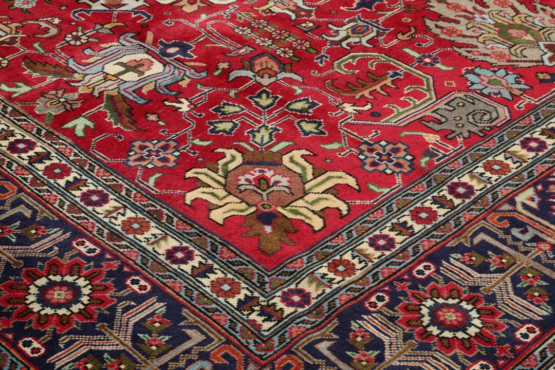 Hand-knotted Tabriz rug from the Middle East in a vibrant red colour