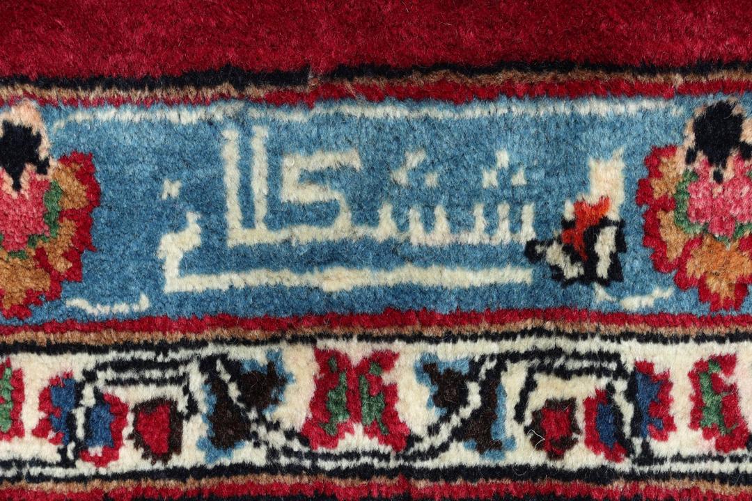 Håndknyttet Mashad-tæppe fra Mellemøsten i dybe røde og blå toner