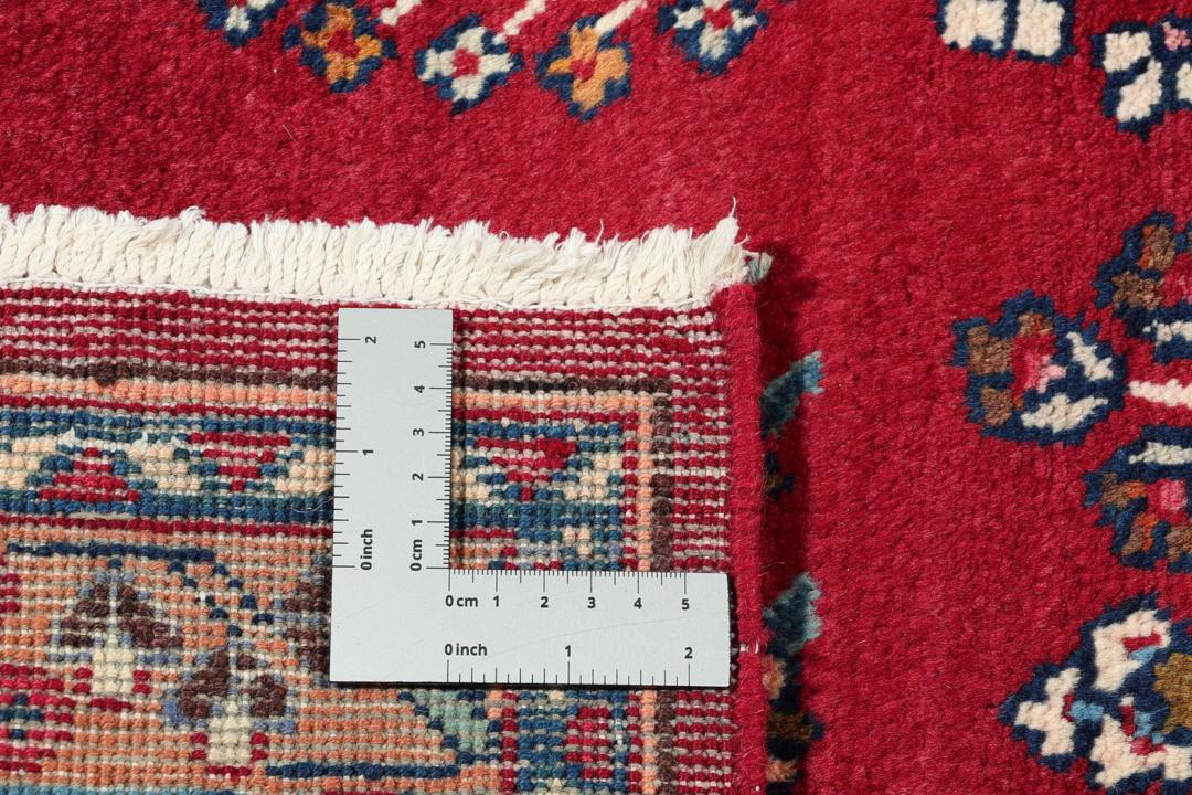Håndknyttet Mashad-tæppe fra Mellemøsten i nuancer af rød og blå.