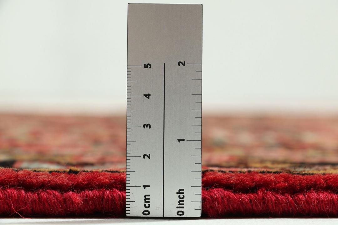 Hand-knotted Hosseinabad runner in red from the Middle East