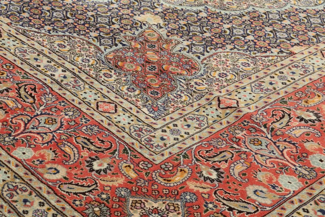 Hand-knotted Moud rug from the Middle East featuring a multicolor floral medallion design.