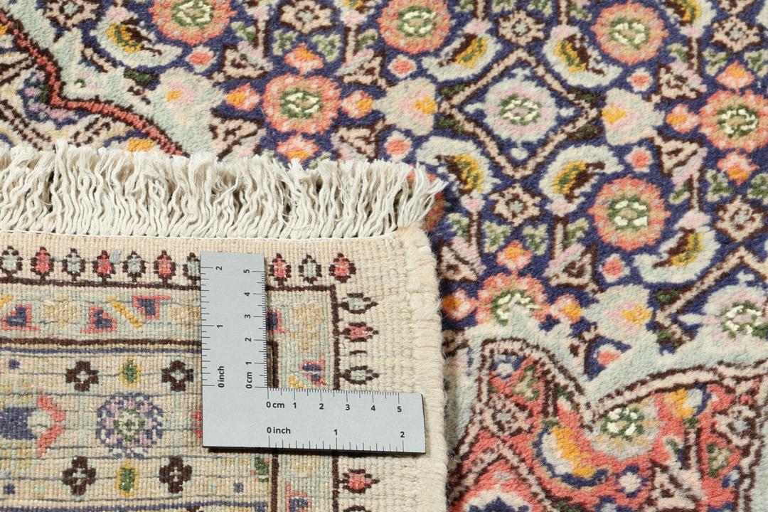 Hand-knotted Moud rug from the Middle East featuring a multicolor floral medallion design.