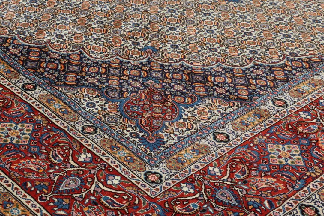 A hand-knotted Moud rug from the Middle East with a detailed medallion in multicolor.