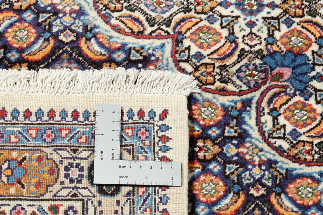 A hand-knotted Moud rug from the Middle East with a detailed medallion in multicolor.