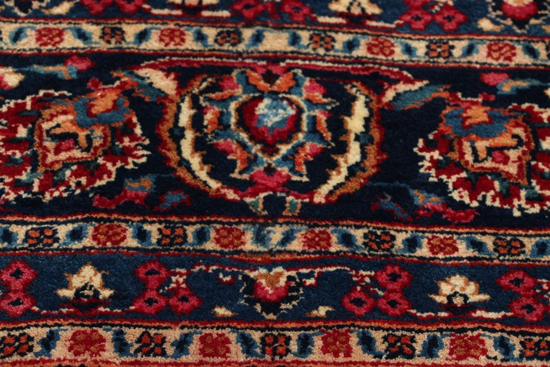 Håndknyttet Mashad-tæppe fra Mellemøsten med et rødt og blåt blomstermedaljon-design