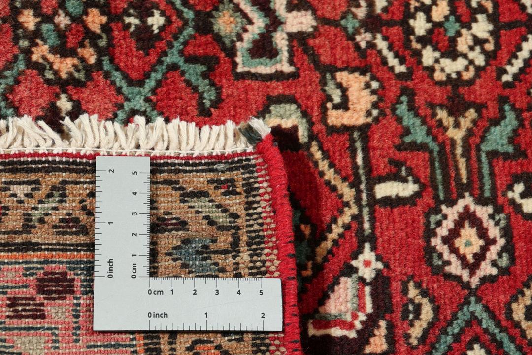 Handgeknoopt Mahal-tapijt uit het Midden-Oosten in levendige rode en donkere tinten