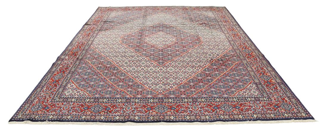 A hand-knotted Moud rug from the Middle East in dark-red and dark-blue tones.