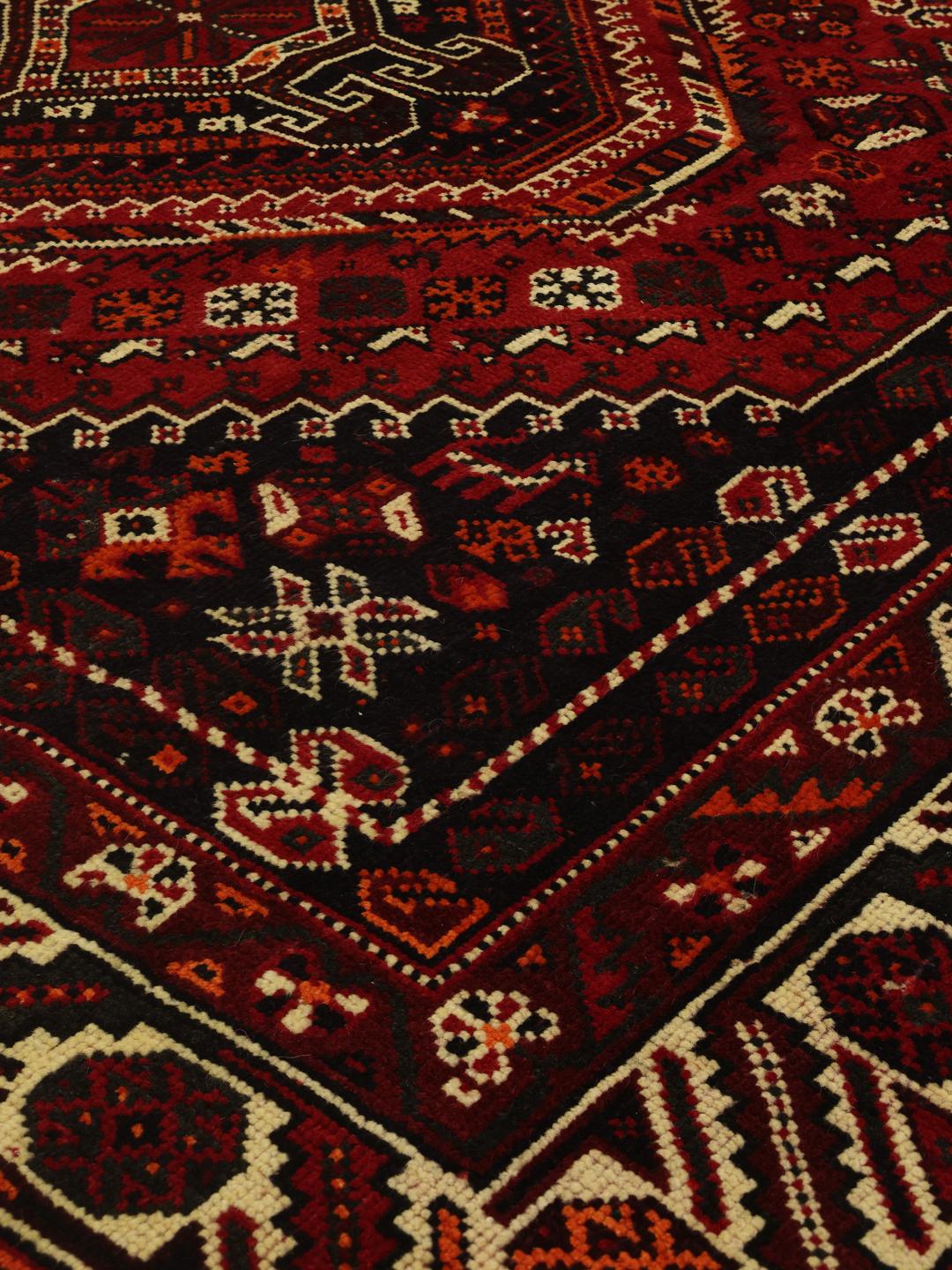 Hand-knotted Shiraz rug from the Middle East in deep red tones