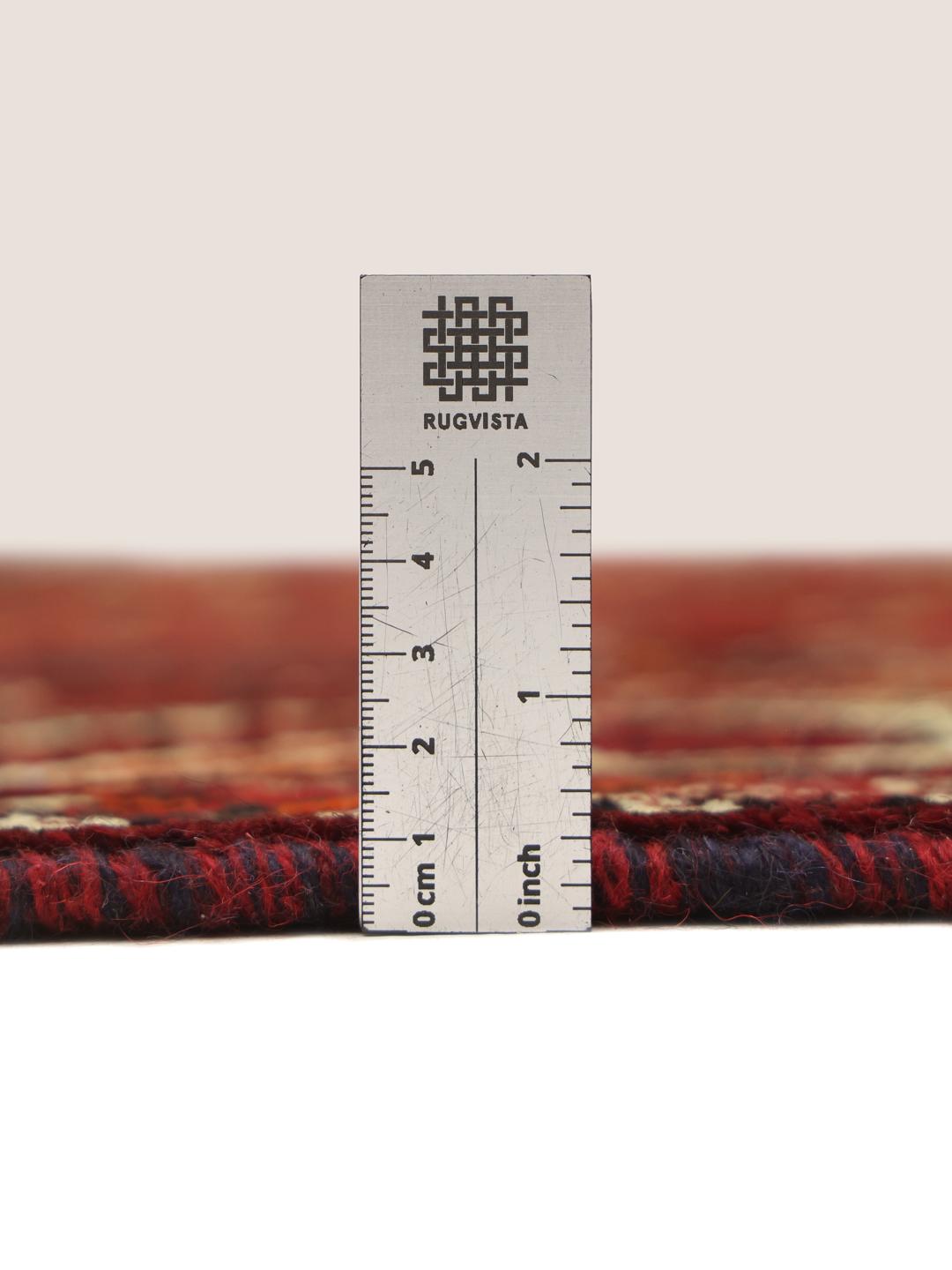 Hand-knotted Shiraz rug from the Middle East in deep red tones