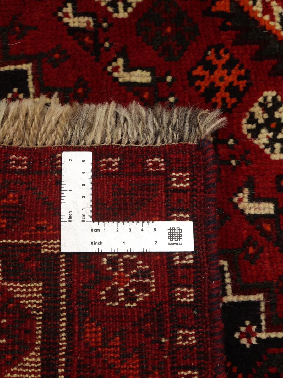 Hand-knotted Shiraz rug from the Middle East in deep red tones