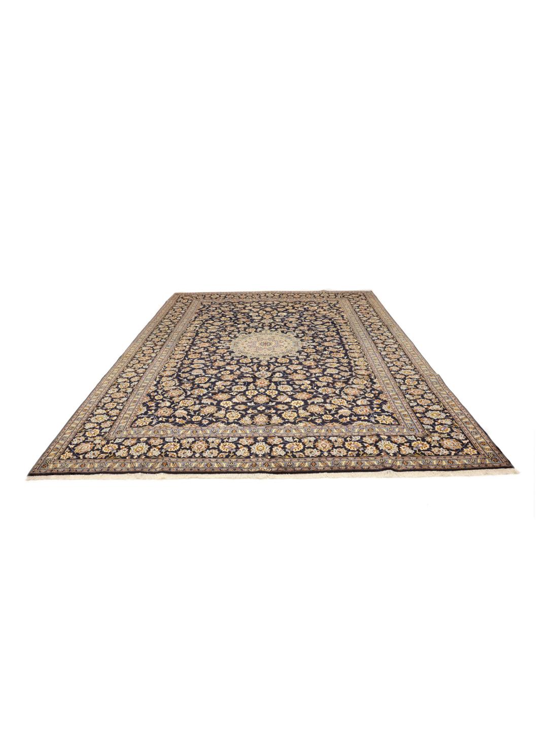 Hand-knotted Keshan rug from the Middle East in dark-blue with a floral medallion pattern.