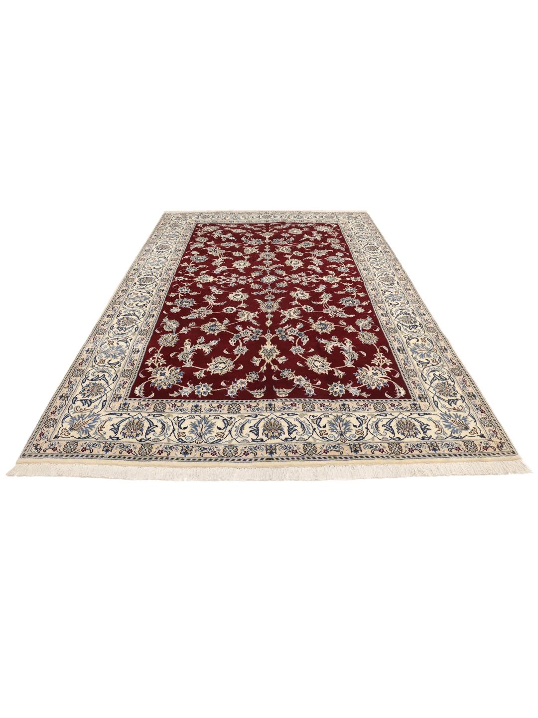 Hand-knotted Nain rug from the Middle East featuring a dark-red floral field and blue border