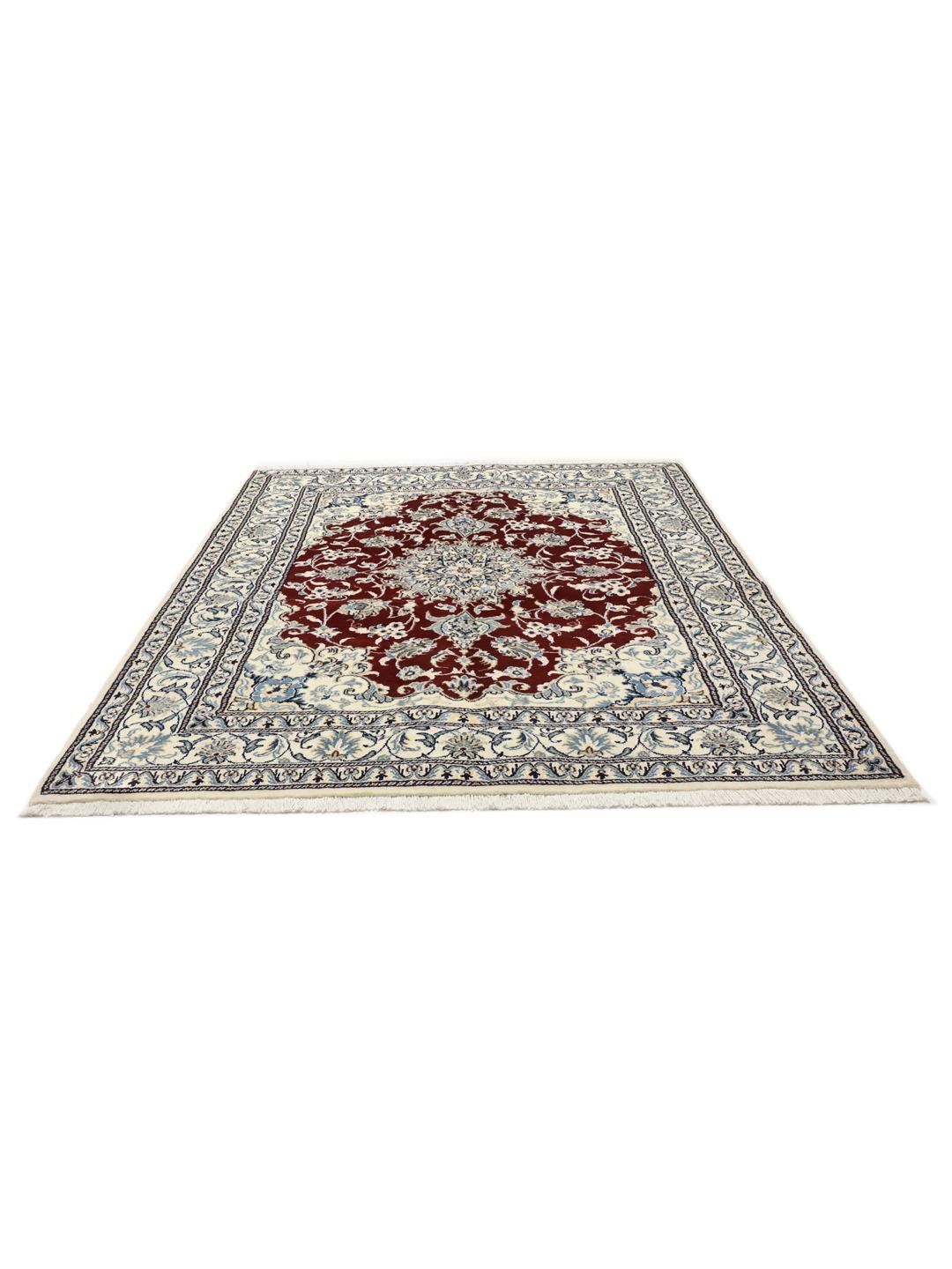 Hand-knotted Nain rug from the Middle East featuring a dark-red and blue floral medallion design.