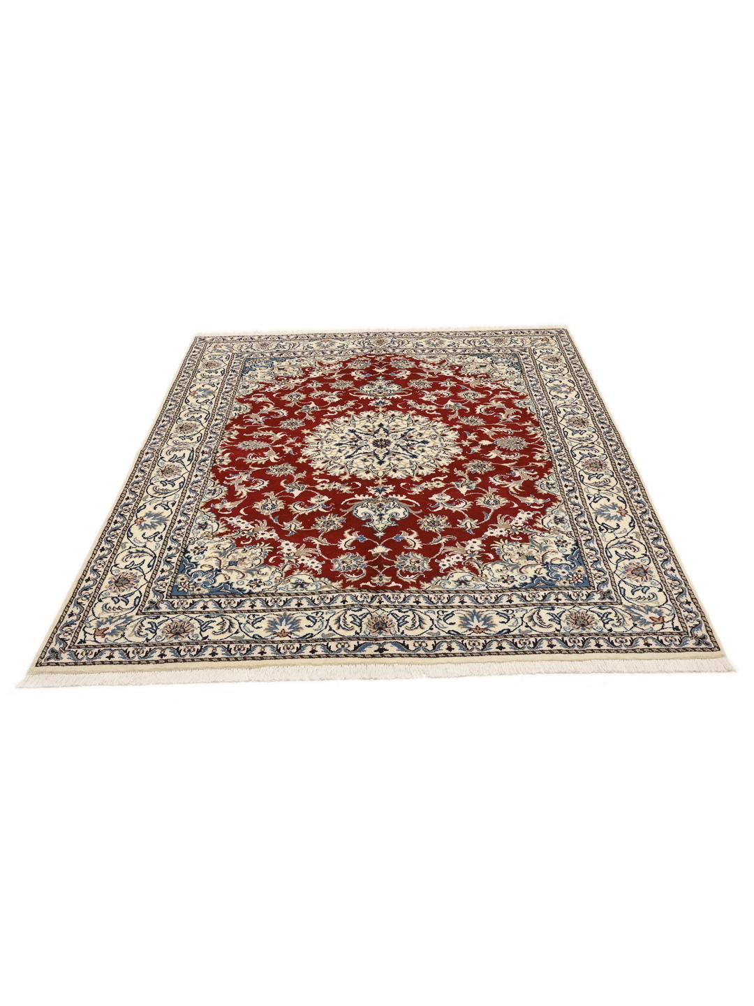 Hand-knotted Nain rug from the Middle East with a red field and floral medallion pattern.