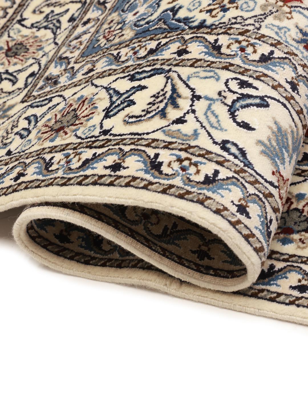 Hand-knotted Nain rug from the Middle East with a red field and floral medallion pattern.