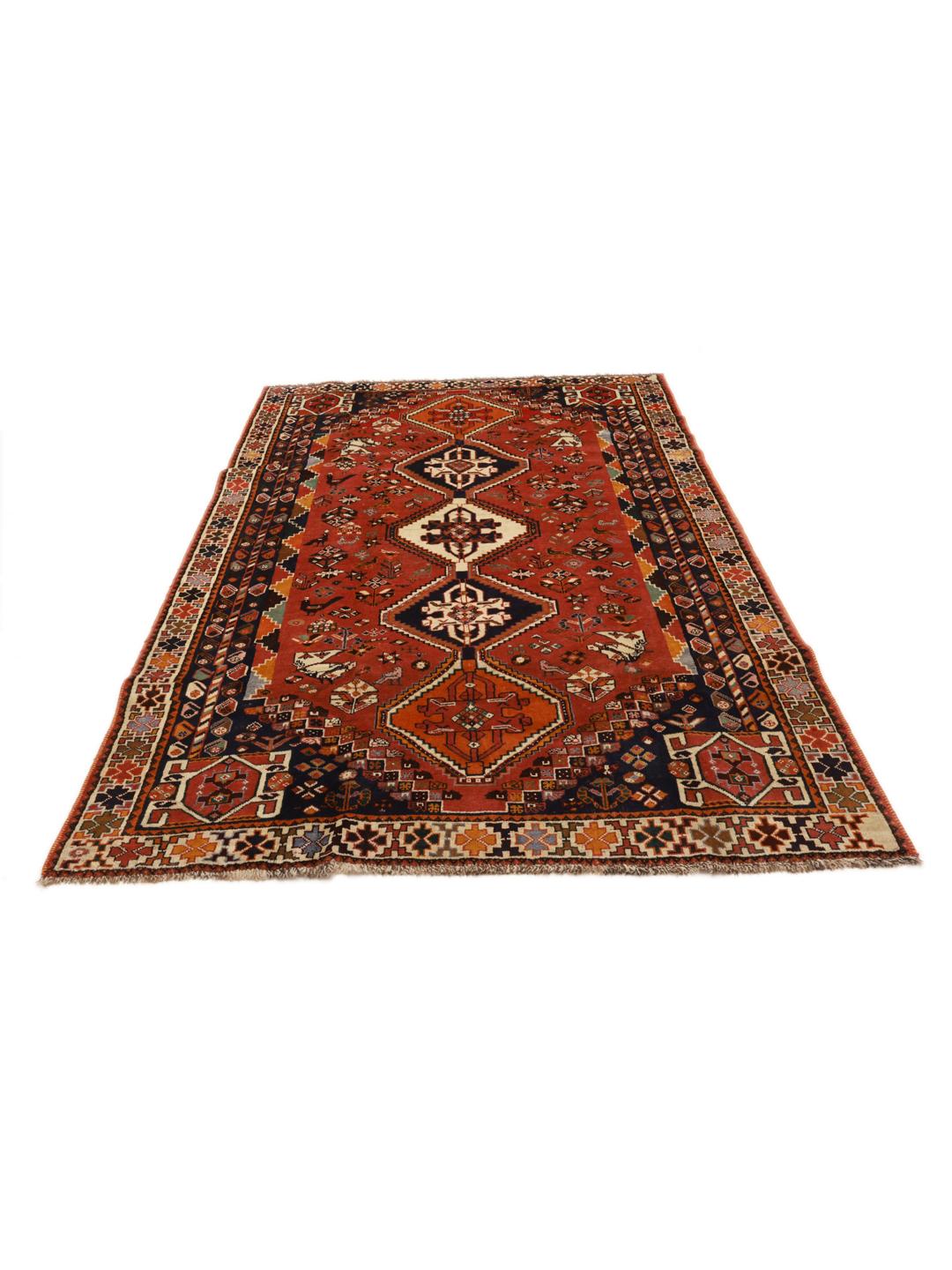 Hand-knotted Shiraz rug from the Middle East in deep red and blue tones