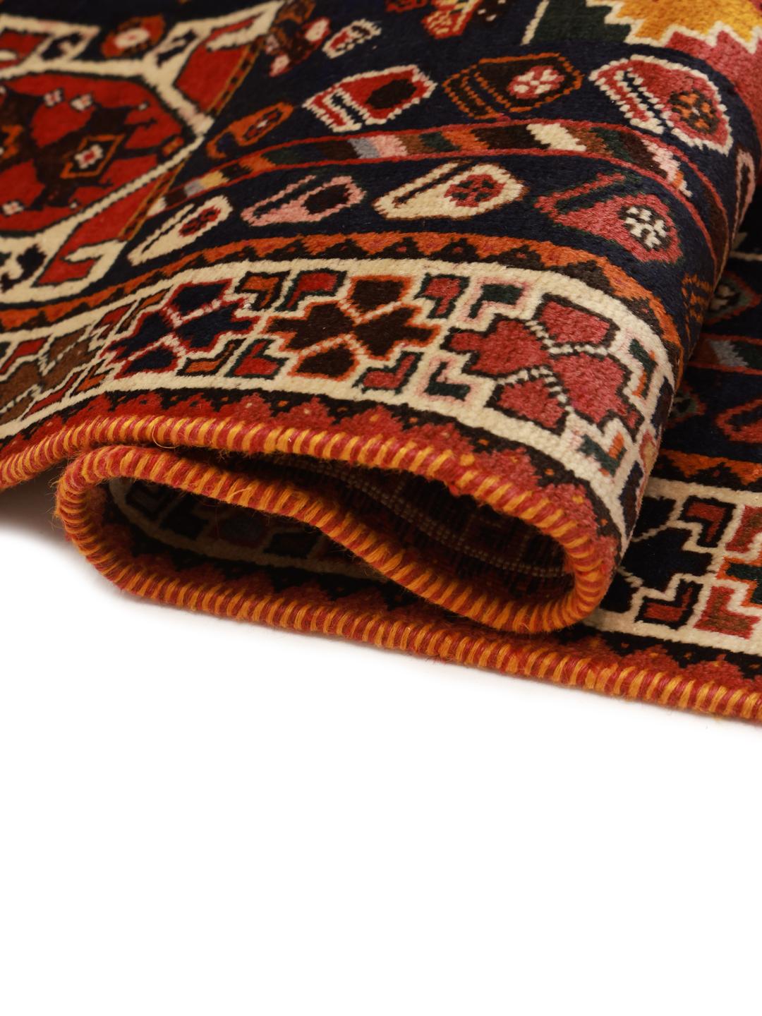 Hand-knotted Shiraz rug from the Middle East in deep red and blue tones