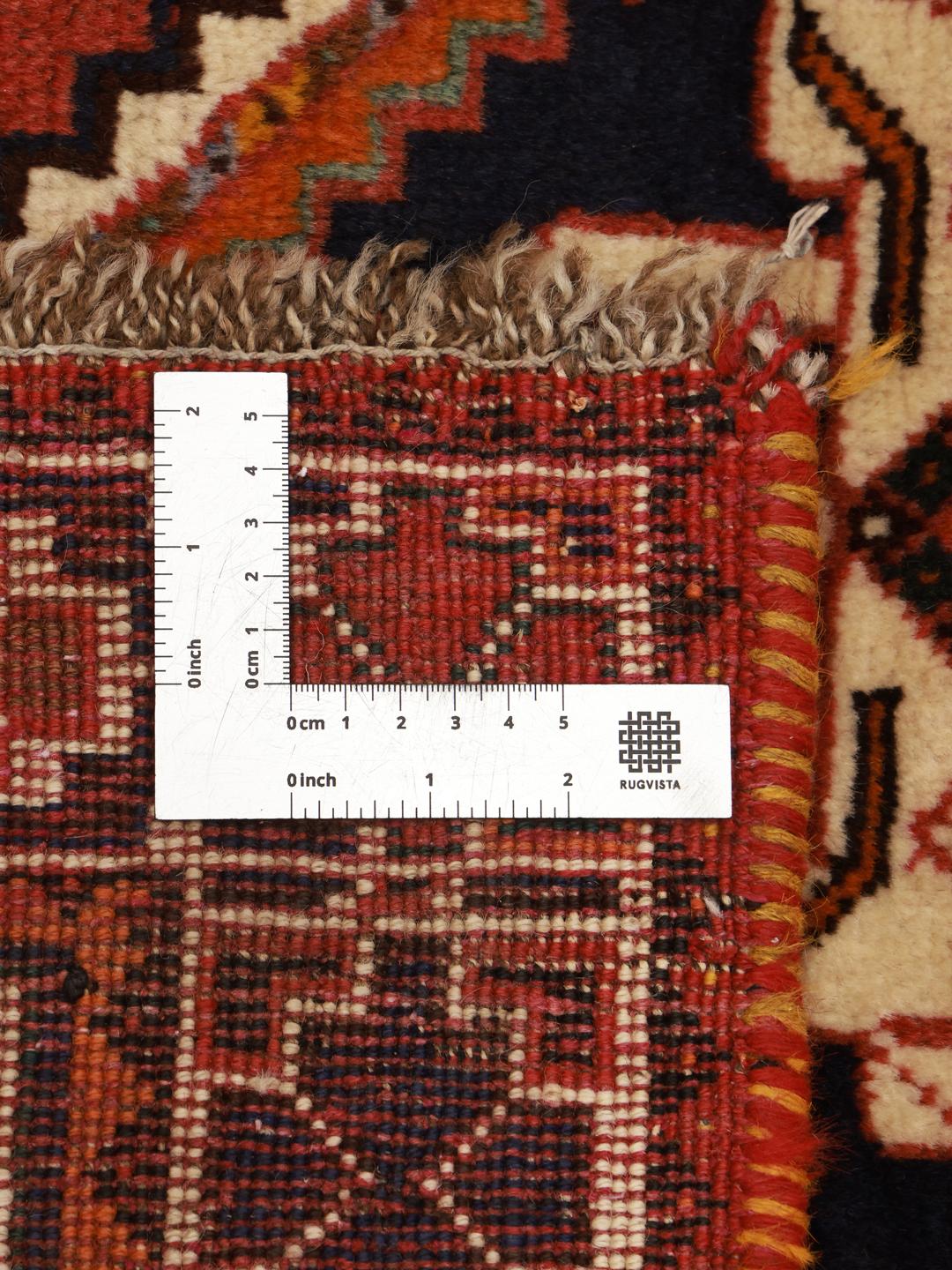 Hand-knotted Shiraz rug from the Middle East in deep red and blue tones