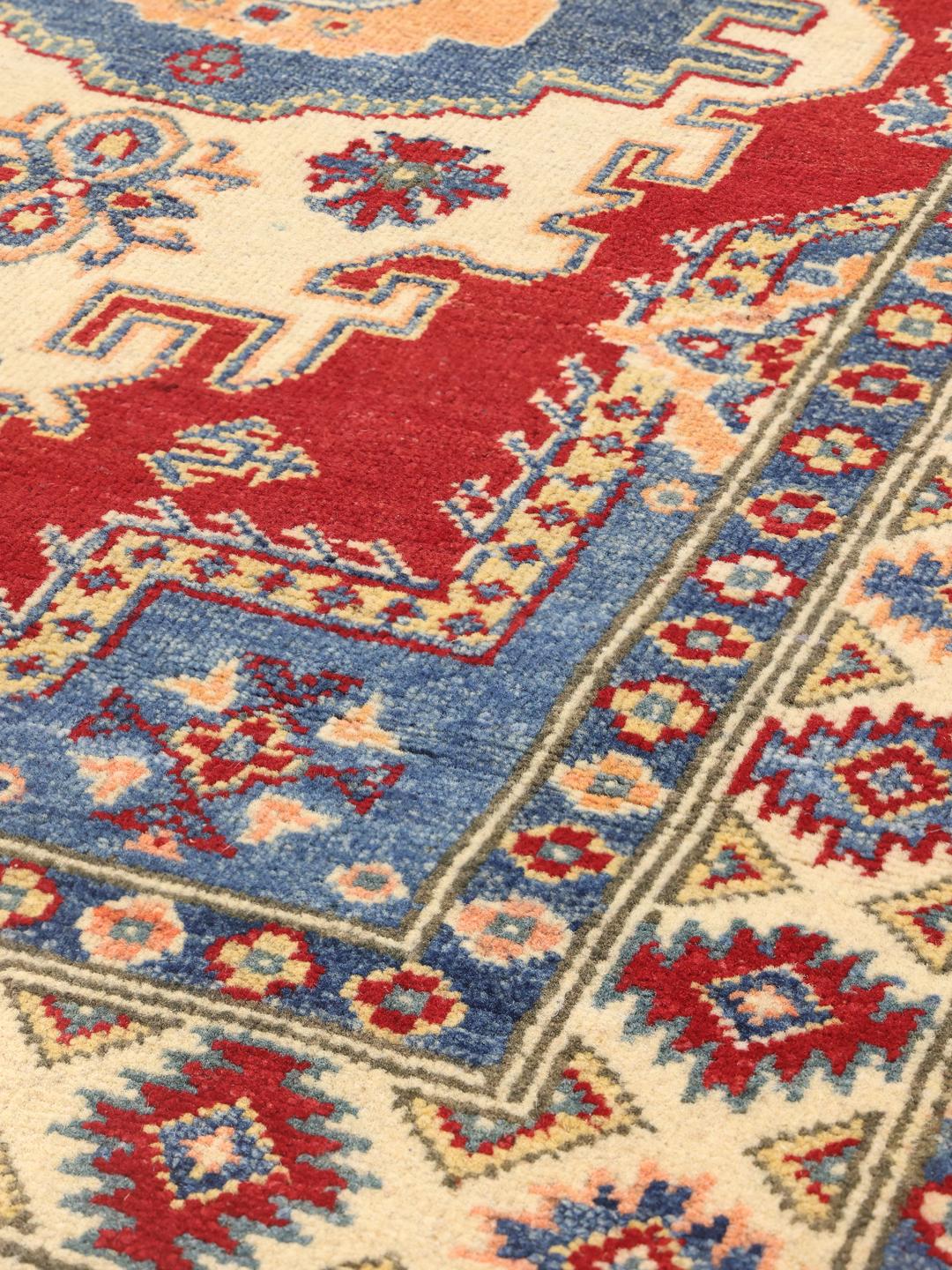 Handgeknoopt Kazak-tapijt uit Afghanistan in rode en blauwe tinten