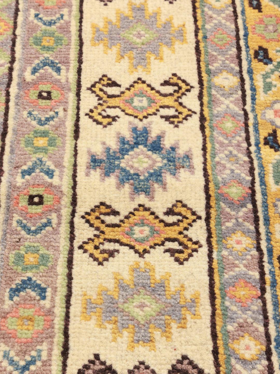 Handgeknoopt Kazak-tapijt uit Afghanistan met blauwe en beige geometrische patronen