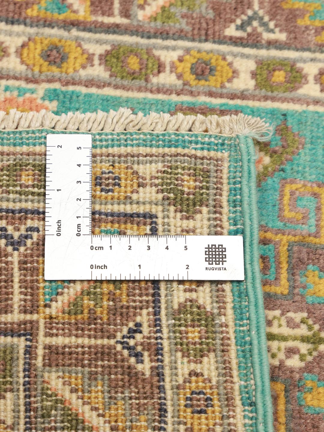 Handgeknoopt Afghaans Kazak-tapijt met blauwe, bruine en okerkleurige geometrische patronen.