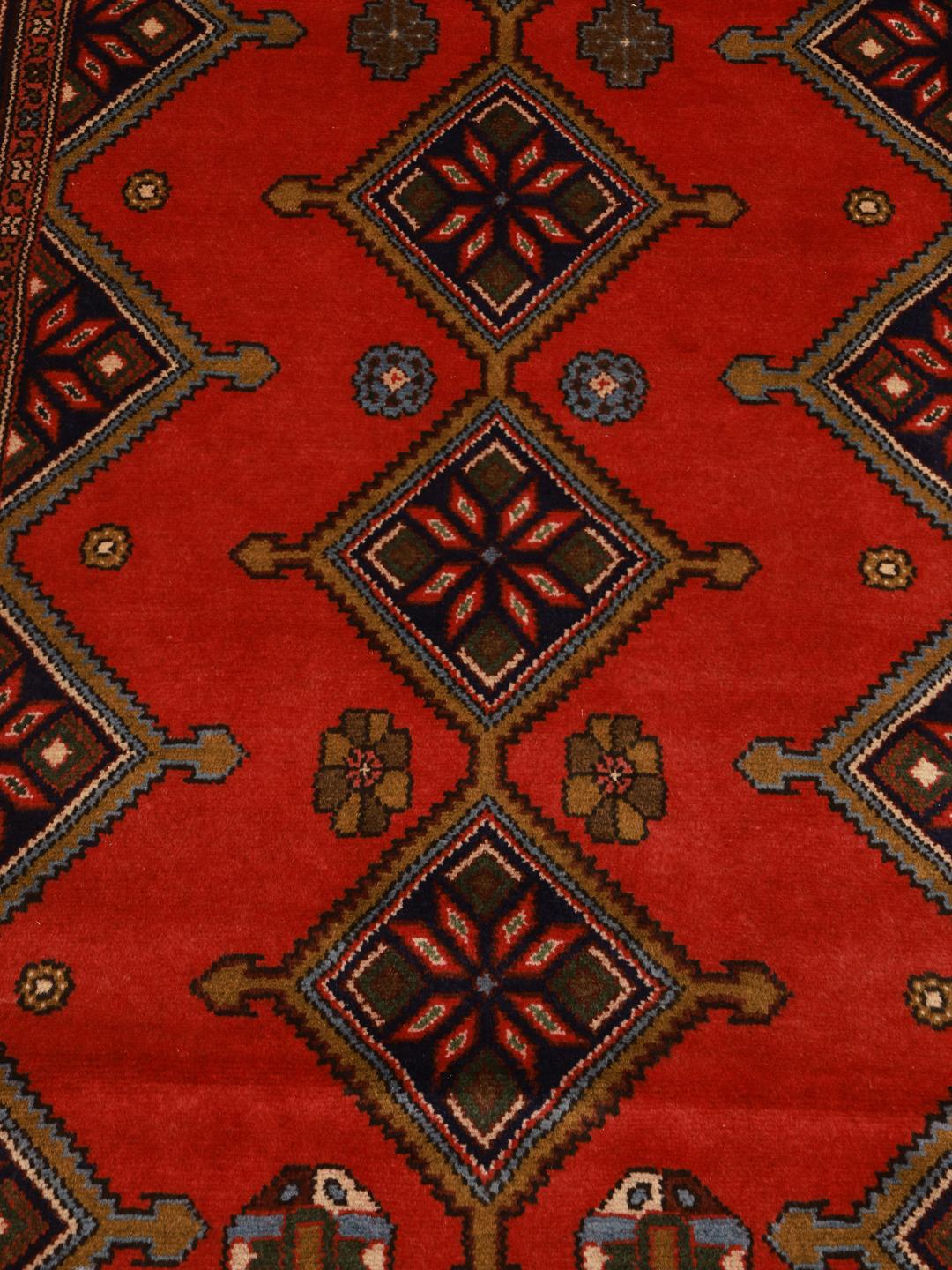 Hand-knotted Middle Eastern runner in red with geometric motifs