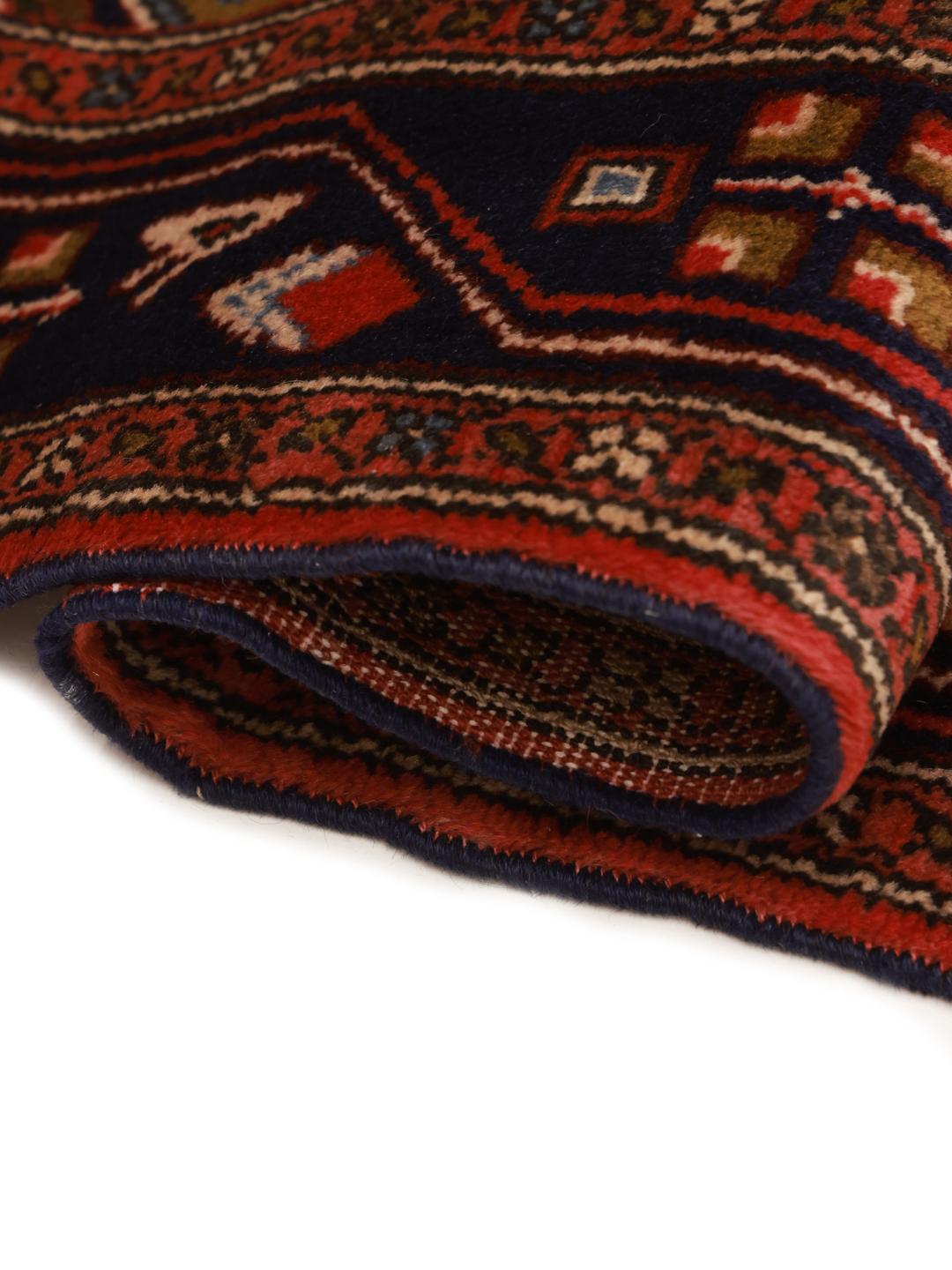 Hand-knotted Middle Eastern runner in red with geometric motifs