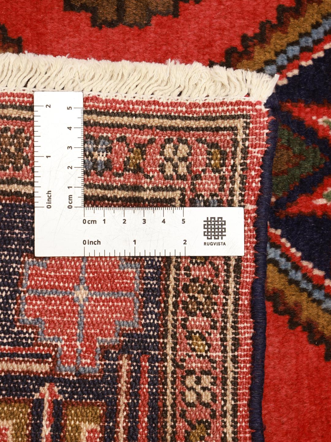 Hand-knotted Middle Eastern runner in red with geometric motifs