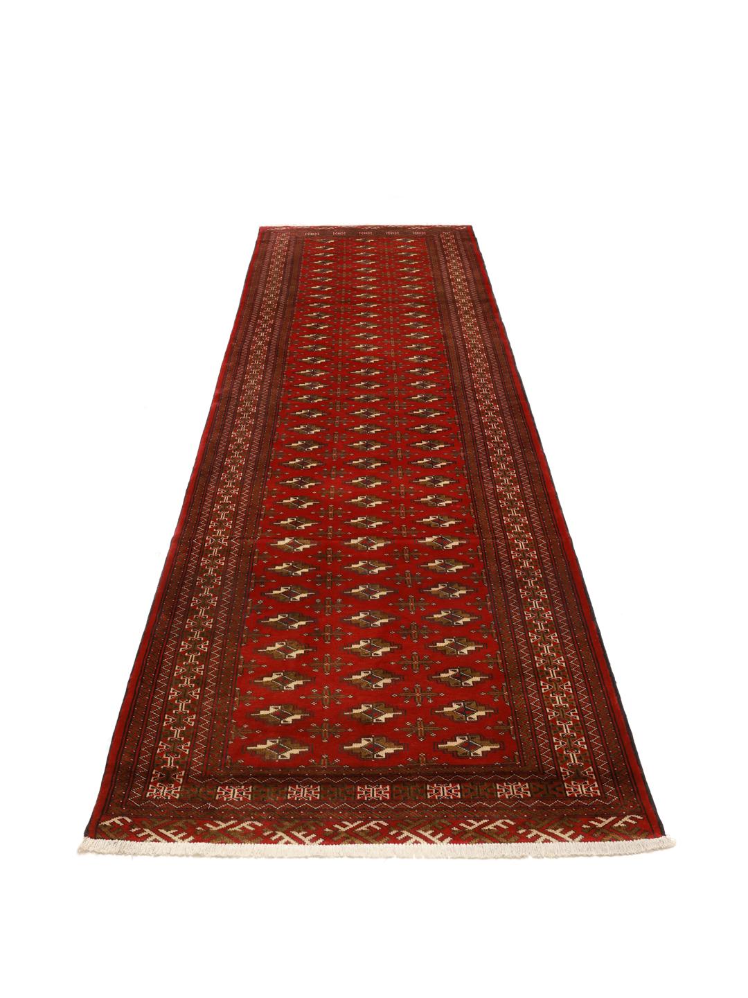 Hand-knotted Turkaman runner from the Middle East in deep red