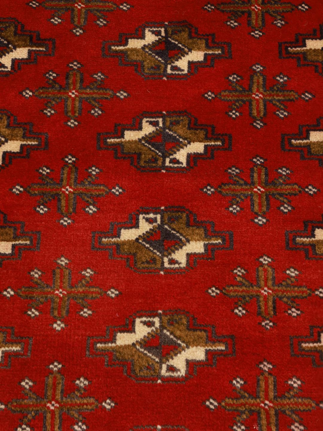 Hand-knotted Turkaman runner from the Middle East in deep red