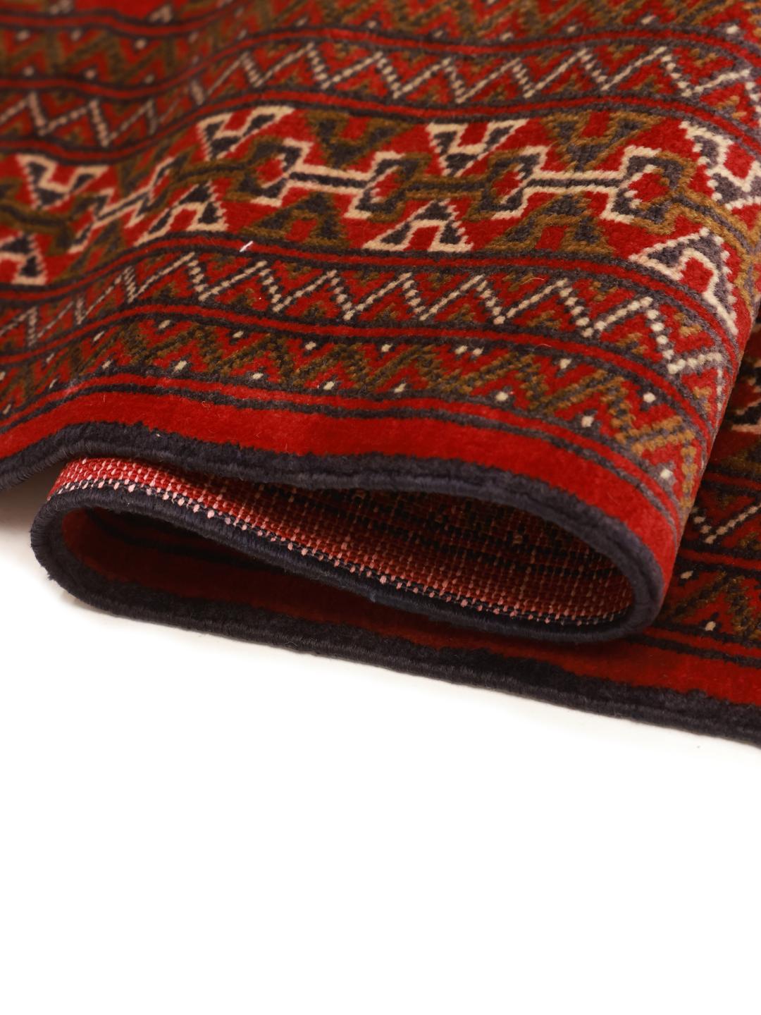 Hand-knotted Turkaman runner from the Middle East in deep red