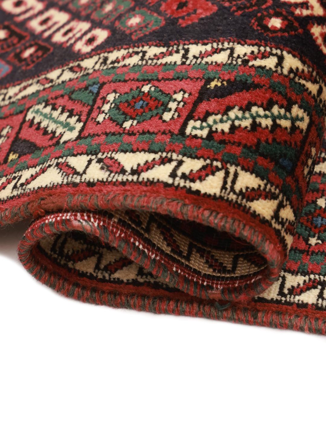 Hand-knotted Afshar Shahre Babak rug with dark-red and black geometric motifs.