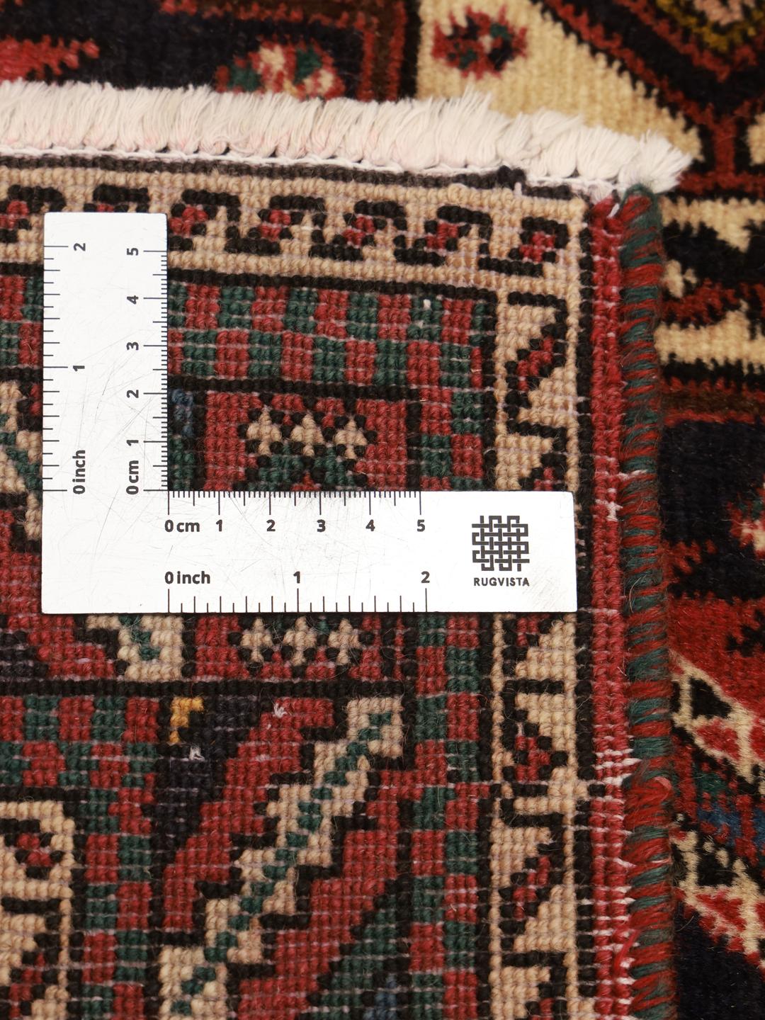 Hand-knotted Afshar Shahre Babak rug with dark-red and black geometric motifs.