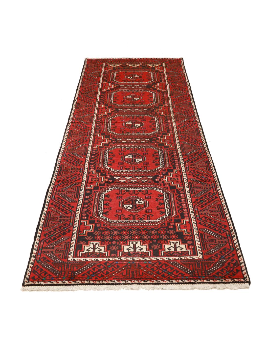A hand-knotted Hamadan runner from the Middle East featuring a red field and traditional geometric motifs.