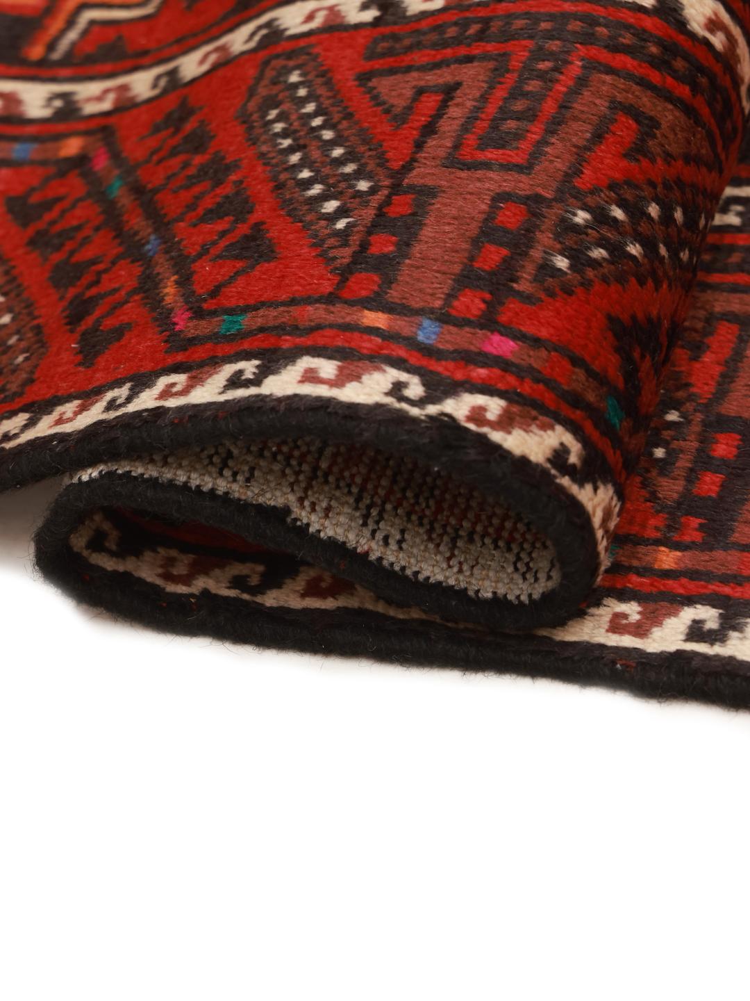 A hand-knotted Hamadan runner from the Middle East featuring a red field and traditional geometric motifs.