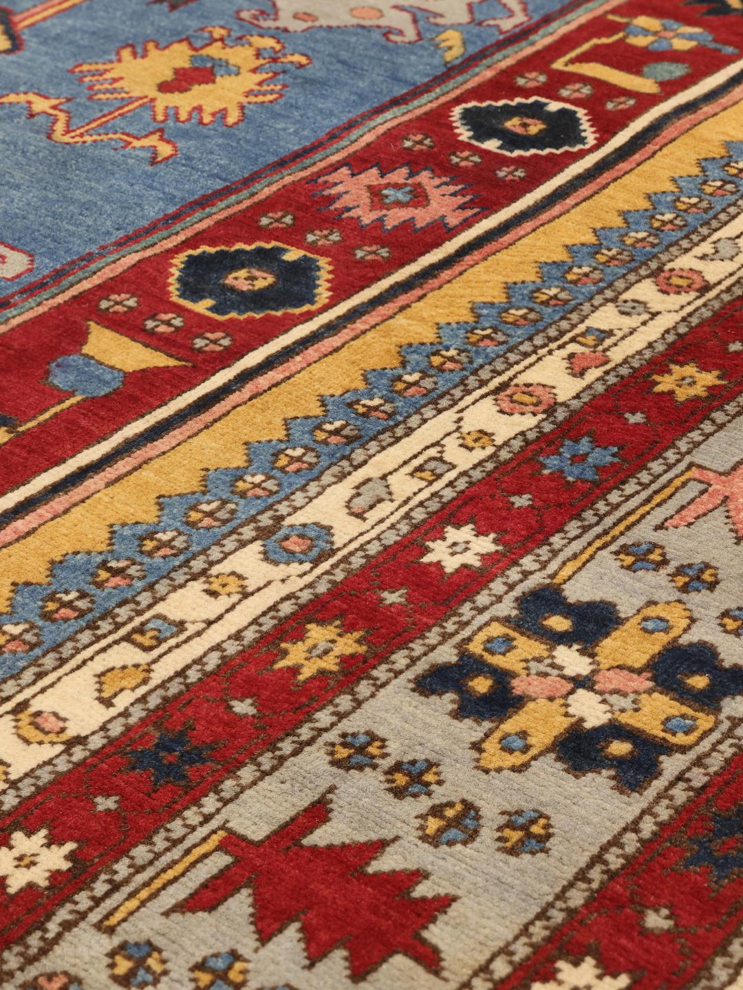 Tapis Kazak afghan noué à la main avec un motif de médaillon rouge et bleu