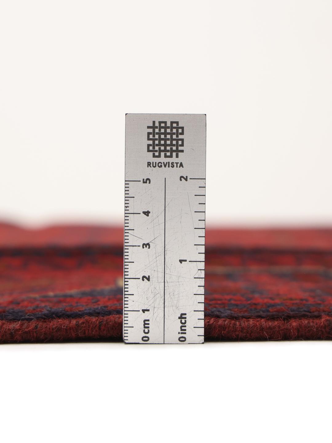 Hand-knotted Afghan Khal Mohammadi rug in rich red tones featuring traditional geometric motifs.