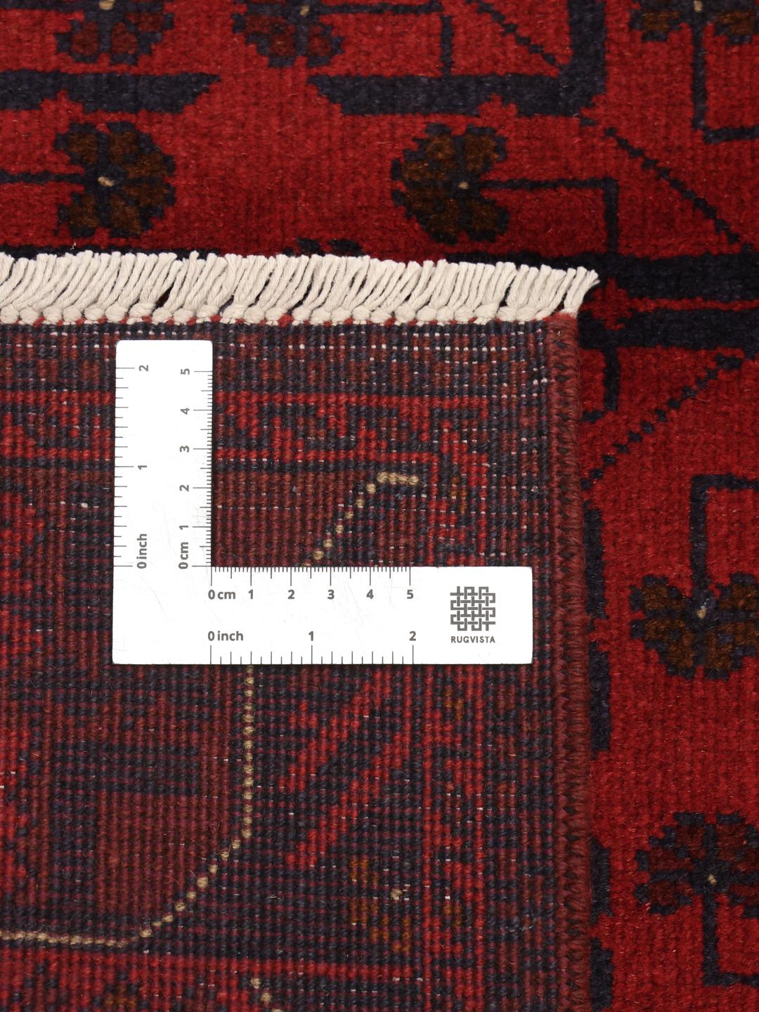 Hand-knotted Afghan Khal Mohammadi rug in rich red tones featuring traditional geometric motifs.