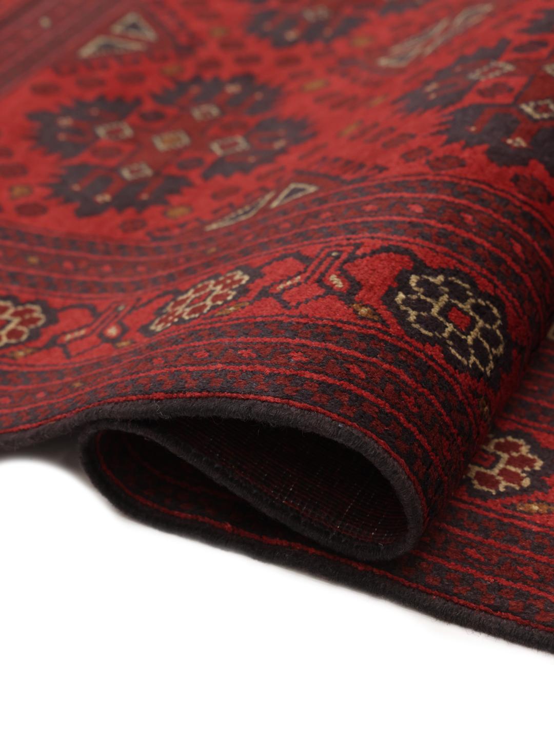 Hand-knotted Afghan Khal Mohammadi rug in dark-red with traditional geometric motifs.