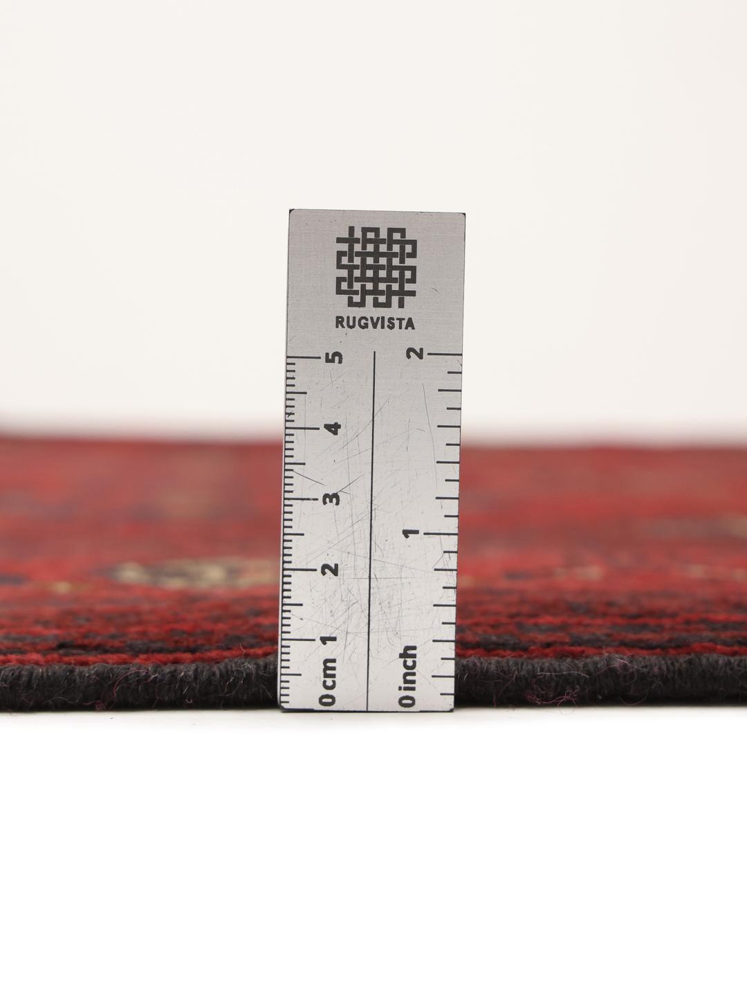 Hand-knotted Afghan Khal Mohammadi rug in dark-red with traditional geometric motifs.