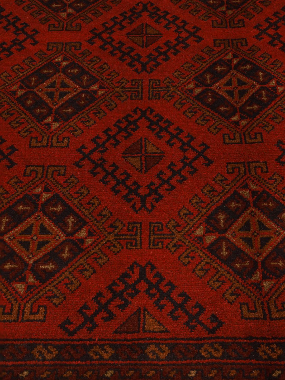 Hand-knotted Afghan Khal Mohammadi rug in dark-red with geometric patterns