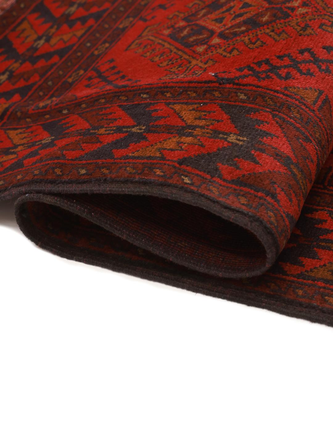 Hand-knotted Afghan Khal Mohammadi rug in dark-red with geometric patterns