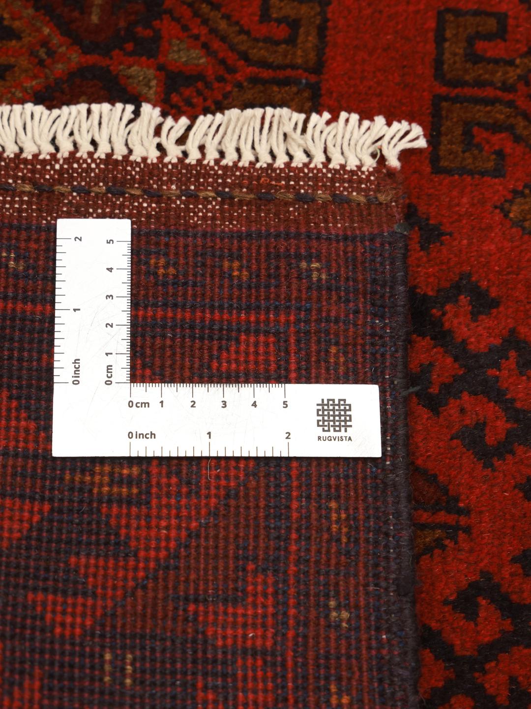 Hand-knotted Afghan Khal Mohammadi rug in dark-red with geometric patterns