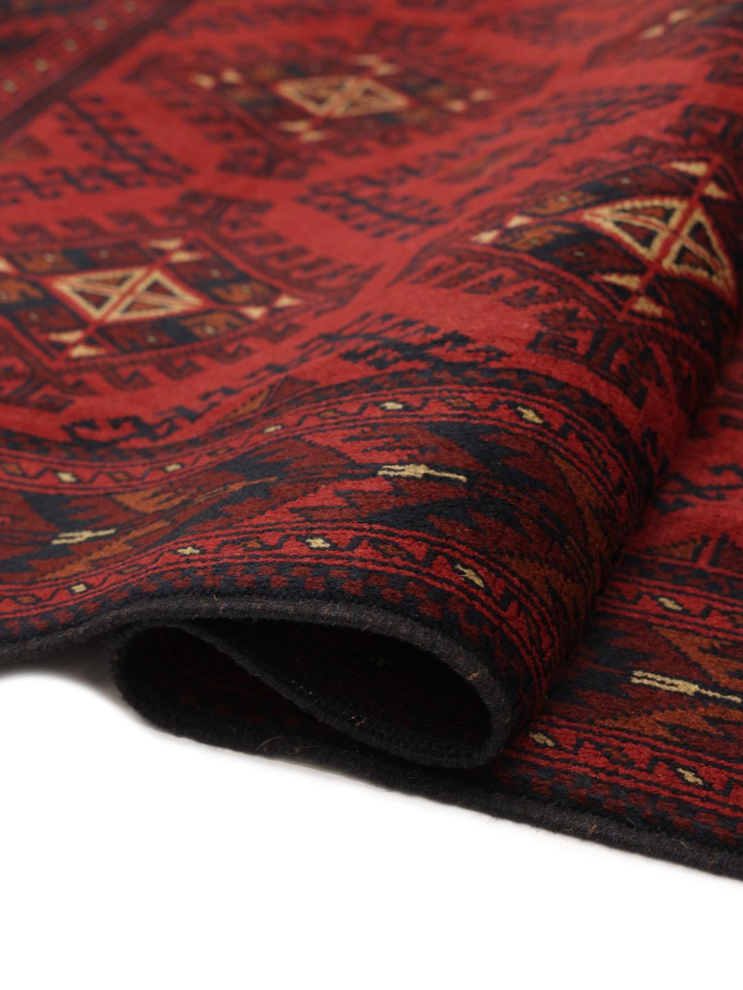 Hand-knotted Afghan Khal Mohammadi rug in dark-red tones.