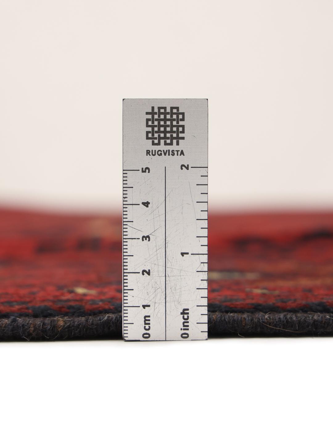 Hand-knotted Afghan Khal Mohammadi rug in dark-red tones.