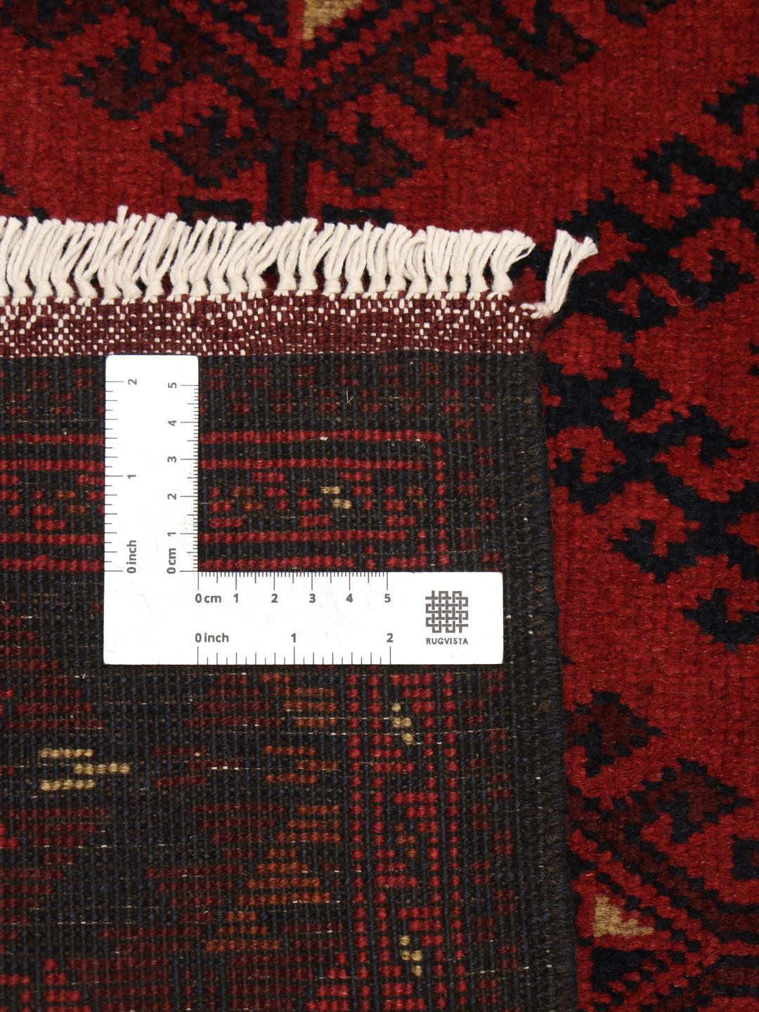 Hand-knotted Afghan Khal Mohammadi rug in dark-red tones.