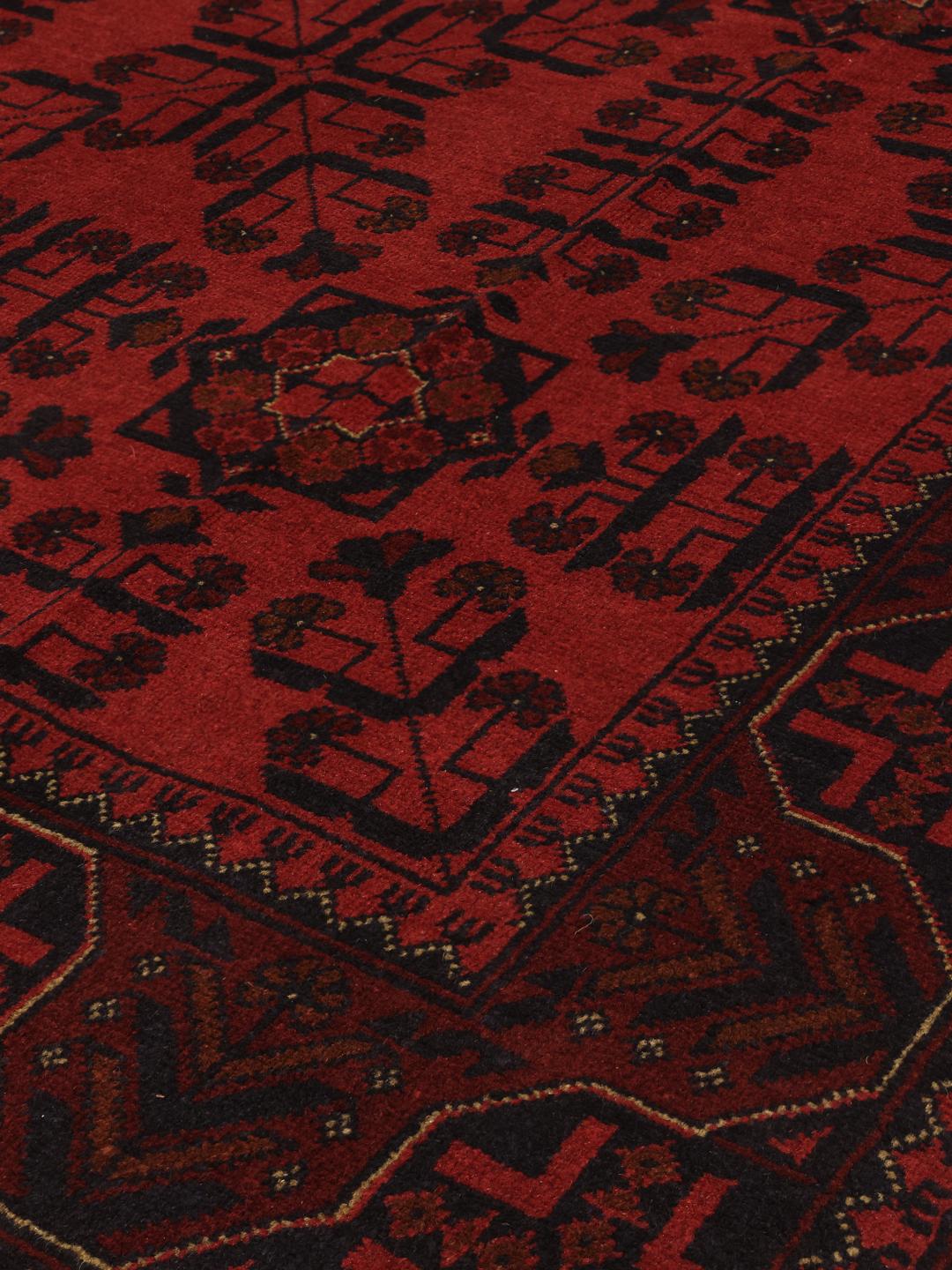 Hand-knotted Afghan Khal Mohammadi rug in deep dark-red with geometric patterns